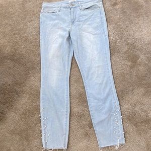 Good American light wash distressed hem jeans with pearl detailing. Size 10/30.